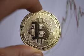 Đồng tiền kỹ thuật số Bitcoin. (Ảnh: AFP/TTXVN) 