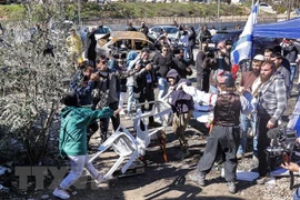 Xung đột giữa người Palestine và người định cư Israel ở khu vực Sheikh Jarrah thuộc Đông Jerusalem ngày 13/2/2022. (Ảnh: AFP/TTXVN) 