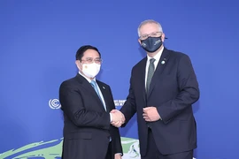 Thủ tướng Phạm Minh Chính gặp Thủ tướng Australia Scott Morrison. (Ảnh: Dương Giang/TTXVN) 