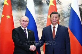 Chủ tịch Trung Quốc Tập Cận Bình (phải) và Tổng thống Nga Vladimir Putin tại cuộc gặp ở Bắc Kinh ngày 16/5/2024. (Ảnh: AFP/TTXVN) 