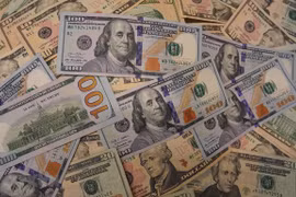 Đồng USD tại một ngân hàng ở Washington, DC. (Ảnh: THX/TTXVN)