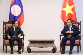 Thủ tướng Chính phủ Phạm Minh Chính tiếp Thủ tướng Lào Phankham Viphavanh. (Ảnh: Dương Giang/TTXVN)