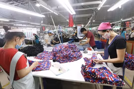 Các dây chuyền dệt may của công ty Cổ phần dệt may Phú Hòa An tại KCN Phú Bài, tỉnh Thừa Thiên Huế. (Ảnh: Anh Tuấn/TTXVN)