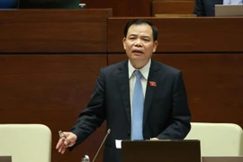 Bộ trưởng Bộ Nông nghiệp và Phát triển Nông thôn Nguyễn Xuân Cường trả lời chất vấn. (Ảnh: Doãn Tấn - TTXVN)