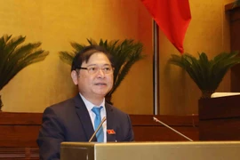 Chủ nhiệm Ủy ban Khoa học, Công nghệ và Môi trường của Quốc hội Phan Xuân Dũng trình bày Báo cáo thẩm tra dự án. (Ảnh: Phương Hoa/TTXVN)
