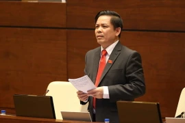 Bộ trưởng Bộ Giao thông Vận tải Nguyễn Văn Thể trả lời chất vấn. (Ảnh: Doãn Tấn/TTXVN)