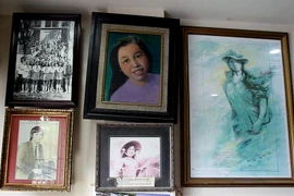 Những bức ảnh liệt sỹ Đặng Thùy Trâm treo trong gia đình. (Ảnh: Doãn Đức/Vietnam+)