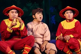 Cảnh trong vở cải lương “Chú Cuội và Cây đa thần. (Ảnh: Hạnh Long/Vietnam+) 