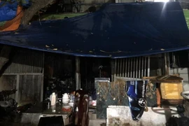 Hiện trường vụ cháy tại nhà số 116 B9 khu tập thể Kim Liên, ngõ 65 Phạm Ngọc Thạch, phường Kim Liên, quận Đống Đa. (Ảnh: TTXVN phát)