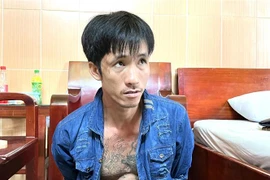 Đối tượng Nguyễn Minh Tâm bị công an bắt giữ. (Ảnh : TTXVN phát)