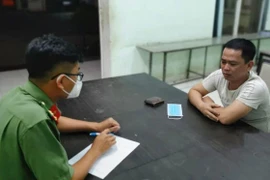 Lê Văn Phụng làm việc với cơ quan công an. (Nguồn: sggp.org.vn)