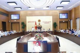 Ủy ban thường vụ Quốc hội biểu quyết thông qua dự thảo Nghị quyết về chức năng, nhiệm vụ, quyền hạn và cơ cấu tổ chức của Ban Công tác đại biểu. (Ảnh: Doãn Tấn/TTXVN)