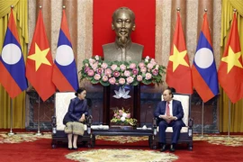 Chủ tịch nước Nguyễn Xuân Phúc tiếp Phó Chủ tịch nước CHDCND Lào Pany Yathotou ngày 26/04/2022 tại Hà Nội. (Ảnh: Thống Nhất/TTXVN)