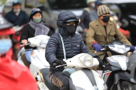 Hà Nội rét đậm. (Ảnh: Thanh Tùng/TTXVN)