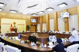 UBTV Quốc hội thông qua dự án Pháp lệnh Xử phạt vi phạm hành chính đối với hành vi cản trở hoạt động tố tụng ngày 18/8. (Ảnh: Doãn Tuấn/TTXVN)