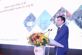 Phó Tổng Giám đốc SCIC Lê Thanh Tuấn báo cáo tại Hội nghị. (Ảnh: VGP)