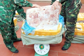 Tang vật nầm lợn đông lạnh nhập lậu bị lực lượng thu giữ. Ảnh minh họa. (Nguồn: TTXVN)