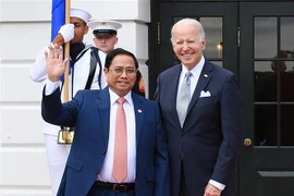 Tổng thống Hoa Kỳ Joseph Robinette Biden Jr. đón Thủ tướng Phạm Minh Chính. (Ảnh: Dương Giang/TTXVN)