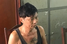 Đối tượng Phạm Văn Giang tại cơ quan điều tra. (Ảnh: Mạnh Tú/TTXVN)