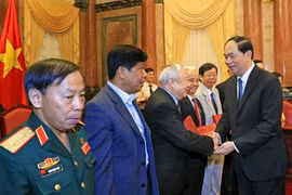 Chủ tịch nước Trần Đại Quang gặp thân mật các đại biểu. (Ảnh: Nhan Sáng/TTXVN)