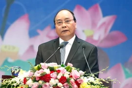 Thủ tướng Nguyễn Xuân Phúc chủ trì Hội nghị Thủ tướng Chính phủ với doanh nghiệp 'Đồng hành cùng doanh nghiệp' năm 2017. (Ảnh: Thống Nhất/TTXVN)