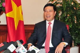 Phó Thủ tướng, Bộ trưởng Ngoại giao Phạm Bình Minh trả lời phỏng vấn phóng viên các cơ quan thông tấn báo chí Việt Nam. (Ảnh: Nguyễn Khang/TTXVN)