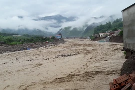 Lũ ống, lũ quét ở thị trấn Ít Ong, huyện Mường La, tỉnh Sơn La. (Ảnh: Nguyễn Cường/TTXVN)