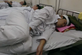 Chiến sỹ Lê Duy Anh gặp tai nạn và hôn mê khi đang tham gia chữa cháy tại tòa nhà CT4 Khu đô thị Xa La. (Ảnh: Võ Phương/Vietnam+)