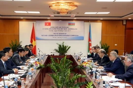 Bộ trưởng Công thương Việt Nam Trần Tuấn Anh và Bộ trưởng Bộ Năng lượng Azerbaijan Natiq Aliyev đồng chủ trì kỳ họp. (Ảnh: Trần Việt/TTXVN)