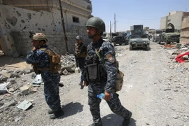 Lực lượng Iraq tuần tra tại Mosul. (Ảnh: AFP/TTXVN)