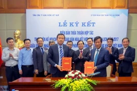 Quang cảnh lễ ký thảo thuận. (Ảnh: Hoàng Ngọc/TTXVN)