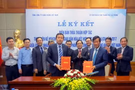 Quang cảnh lễ ký thảo thuận. (Ảnh: Hoàng Ngọc/TTXVN)