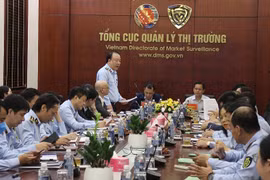 Ký kết Chương trình hợp tác giữa Bộ Tài chính và Bộ Công Thương. (Ảnh: Đức Duy/Vietnam+)