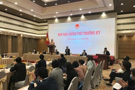 Bộ trưởng Mai Tiến Dũng chủ trì Họp báo Chính phủ tháng 1/2021. (Ảnh: Đức Duy/Vietnam+)