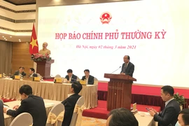 Bộ trưởng Mai Tiến Dũng chủ trì Họp báo Chính phủ tháng 2/2021. (Ảnh: Đức Duy/Vietnam+)