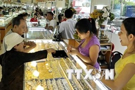 Giao dịch vàng tại Thành phố Hồ Chí Minh. (Nguồn: TTXVN).