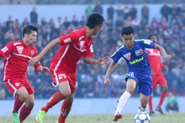 Thanh Tùng (số 18) là người hùng mới của Hoàng Anh Gia Lai sau cú đúp vào lưới Bình Dương. (Ảnh: Minh Chiến/Vietnam+)