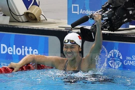 Ánh Viên ăn mừng sau một tấm huy chương vàng giành được ở SEA Games. (Ảnh: TTXVN)