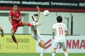 Tuyển Việt Nam và Singapore bất phân thắng bại. (Ảnh: Hữu Phạm/Vietnam+)