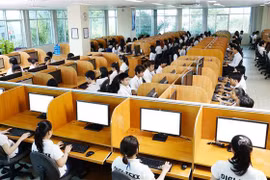 Hoạt động tại Công ty TNHH Digi-Texx (Đức) tại Công viên phần mềm Quang Trung - một trong những công ty tiên phong và hàng đầu trong lĩnh vực BPO (dịch vụ thuê ngoài) tại Việt Nam. (Ảnh: TTXVN phát)