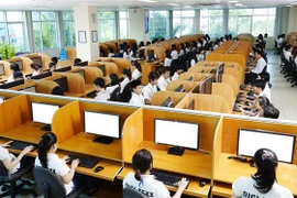 Hoạt động tại Công ty TNHH Digi-Texx (Đức) tại Công viên phần mềm Quang Trung - một trong những công ty tiên phong và hàng đầu trong lĩnh vực BPO (dịch vụ thuê ngoài) tại Việt Nam. (Ảnh: TTXVN phát)