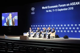 Phiên thảo luận với chủ đề Xung đột thương mại: Vượt qua căng thẳng địa kinh tế. (Ảnh: Nguyễn Khang/TTXVN)