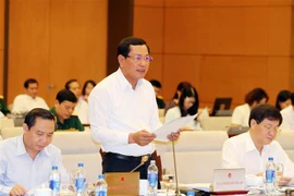 Đại diện Viện kiểm sát nhân dân tối cao trình bày báo cáo công tác. (Ảnh: Trọng Đức/TTXVN)