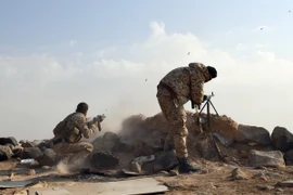 Các lực lượng Syria tại khu vực Sawwan, phía nam Khanasser, khi đang trên đường tiến về khu vực phiến quân kiểm soát tại Idlib ngày 19/11. (Nguồn: AFP/TTXVN)