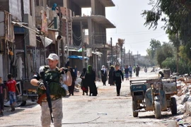 Cảnh sát quân sự Nga tăng cường an ninh tại Jibrin, ngoại ô thành phố Aleppo ngày 16/8. (Nguồn: AFP/TTXVN)