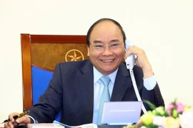 Thủ tướng Nguyễn Xuân Phúc điện đàm với Thủ tướng Nhật Bản Shinzo Abe. (Ảnh: Thống Nhất/TTXVN)