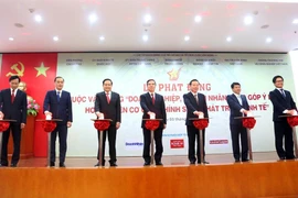 Lễ phát động Cuộc vận động “Doanh nghiệp, doanh nhân đóng góp ý kiến hoàn thiện cơ chế, chính sách phát triển kinh tế,” ngày 3/9. (Ảnh" BKT/Vietnam+)