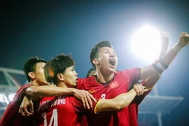 Tinh thần đoàn kết, kỷ luật và ý chí quật cường làm nên những thành công của đội tuyển Việt Nam ở sân chơi quốc tế. (Ảnh: Trọng Đạt/TTXVN)