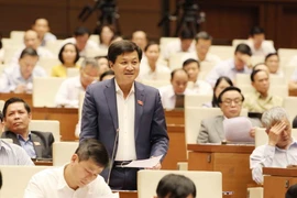 Tổng Thanh tra Chính phủ Lê Minh Khái trả lời chất vấn của Đại biểu Quốc hội. (Ảnh: Phương Hoa/TTXVN)