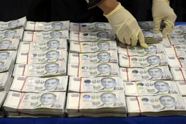 Số tiền cảnh sát thu lại sau vụ cướp táo tợn. (Ảnh: ST FILE)